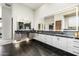 Modern bathroom with dual sinks, black countertops, and unique lighting at 9127 N Fireridge Trl, Fountain Hills, AZ 85268