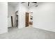 A bright, open bedroom boasts neutral carpet, an open door to the seating area, and a walk-in closet at 9127 N Fireridge Trl, Fountain Hills, AZ 85268