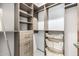A walk-in closet provides ample storage with shelves, drawers, and hanging rods for organized convenience at 9127 N Fireridge Trl, Fountain Hills, AZ 85268