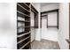 A well-organized walk-in closet offers ample storage space with custom shelving and hanging rods at 9127 N Fireridge Trl, Fountain Hills, AZ 85268