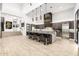 Spacious kitchen boasts stainless steel appliances, a large center island with seating, and modern light fixtures at 9127 N Fireridge Trl, Fountain Hills, AZ 85268