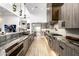 Gourmet kitchen with stainless steel appliances, granite countertops, custom cabinets, and modern fixtures at 9127 N Fireridge Trl, Fountain Hills, AZ 85268