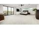 Bright main bedroom with a balcony and floor to ceiling sliding glass doors with desert views at 9127 N Fireridge Trl, Fountain Hills, AZ 85268