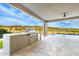 Well-equipped outdoor kitchen with barbecue grill and scenic views at 9127 N Fireridge Trl, Fountain Hills, AZ 85268