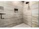 Contemporary shower featuring light stone tile and hexagon mosaic floor at 9127 N Fireridge Trl, Fountain Hills, AZ 85268