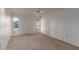 Bright bedroom featuring neutral walls, carpet and a window at 15462 N Lakeforest Dr, Sun City, AZ 85351