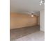 Open living room with tile floors and a ceiling fan at 15462 N Lakeforest Dr, Sun City, AZ 85351
