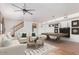 Spacious living room with hardwood floors, ceiling fan, billiard table, and comfortable seating at 1758 W Aster Dr, Phoenix, AZ 85029