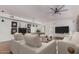 Open-concept living room with a billiard table, ceiling fan, and comfortable furniture at 1758 W Aster Dr, Phoenix, AZ 85029