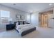 Bright bedroom features stylish decor, bedside tables, and large windows at 17894 W Hood River Rd, Surprise, AZ 85388