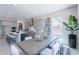 Elegant dining area with a modern table, stylish seating, and natural light at 17894 W Hood River Rd, Surprise, AZ 85388