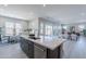 Spacious kitchen island overlooks the dining and living areas, perfect for modern living at 17894 W Hood River Rd, Surprise, AZ 85388