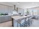 Bright, modern kitchen with sleek gray cabinets, a spacious island, and stainless steel appliances at 17894 W Hood River Rd, Surprise, AZ 85388