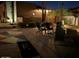 Inviting backyard with a colorful game area, comfortable seating, and desert landscaping at 1932 E Beck Ln, Phoenix, AZ 85022