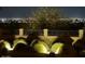 Manicured landscaping and city views are seen at night at 1932 E Beck Ln, Phoenix, AZ 85022