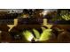 Manicured landscaping with decorative lighting and a view of the city at 1932 E Beck Ln, Phoenix, AZ 85022