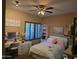 Bright bedroom with flamingo artwork above the bed and a vanity with a mirror at 1932 E Beck Ln, Phoenix, AZ 85022