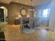 Elegant dining room with large window, designer chandelier, and table with seating for eight at 1932 E Beck Ln, Phoenix, AZ 85022