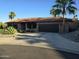 Beautiful single-story home with a Spanish tile roof, desert landscaping, and an attached two-car garage at 1932 E Beck Ln, Phoenix, AZ 85022