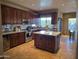 Spacious kitchen featuring custom cabinets, stainless steel appliances, granite countertops, and central island at 1932 E Beck Ln, Phoenix, AZ 85022