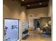 Inviting living area with vaulted wood ceilings, stone floors, and a large window at 1932 E Beck Ln, Phoenix, AZ 85022