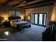 Relaxing bedroom with wood ceiling, a king bed, and access to the private outdoor space at 1932 E Beck Ln, Phoenix, AZ 85022
