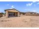Backyard featuring desert landscaping, a covered patio, and ample space to customize the outdoor area at 22131 E Estrella Rd, Queen Creek, AZ 85142