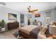 Comfortable bedroom with a ceiling fan, a serene view and hardwood floors at 22131 E Estrella Rd, Queen Creek, AZ 85142