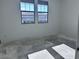 This bedroom features tile flooring and dual windows offering lots of natural light at 32155 N Lone Rancher Way, San Tan Valley, AZ 85140