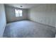 An unfinished bedroom features natural light, a modern window, and electrical wiring ready for customization at 32155 N Lone Rancher Way, San Tan Valley, AZ 85140