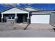 Charming single-story home featuring a two car garage and rock accents at 32155 N Lone Rancher Way, San Tan Valley, AZ 85140