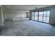 Unfinished living room with large glass patio doors, recessed lighting, and ample space for customization at 32155 N Lone Rancher Way, San Tan Valley, AZ 85140