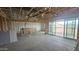 Large unfinished room with insulation, framing, and sliding glass doors leading to the yard at 32155 N Lone Rancher Way, San Tan Valley, AZ 85140