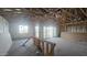 Spacious unfinished room with insulation, framing, large window and sliding glass doors at 32155 N Lone Rancher Way, San Tan Valley, AZ 85140