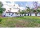 Expansive backyard featuring lush lawn and a charming detached garage with convenient patio space at 4333 N 15Th Dr, Phoenix, AZ 85015