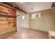 Spacious basement showcasing the concrete flooring and block wall, offering versatile potential at 4333 N 15Th Dr, Phoenix, AZ 85015