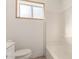 Simple bathroom view featuring a white tub and window providing natural light at 4333 N 15Th Dr, Phoenix, AZ 85015