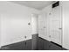 Bedroom featuring black floors, white walls, and two large closets at 4333 N 15Th Dr, Phoenix, AZ 85015