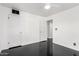 Bedroom featuring black floors, white walls, and views to the outside at 4333 N 15Th Dr, Phoenix, AZ 85015