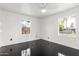 Bright bedroom with two windows offering natural light and sleek black floors at 4333 N 15Th Dr, Phoenix, AZ 85015