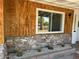 Charming home featuring decorative stone, wood siding and well-maintained cacti landscaping at 4333 N 15Th Dr, Phoenix, AZ 85015