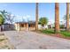 Features a large driveway and manicured lawn with mature trees in front of this cozy home at 4333 N 15Th Dr, Phoenix, AZ 85015