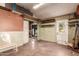 Garage interior view highlighting the open space with wooden shelving and storage solutions at 4333 N 15Th Dr, Phoenix, AZ 85015