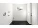 Functional laundry room with black floor and simple window for natural light at 4333 N 15Th Dr, Phoenix, AZ 85015