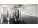 Open living space with sleek black floors and an open layout leading to the kitchen at 4333 N 15Th Dr, Phoenix, AZ 85015