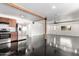 Bright and spacious living area with sleek black flooring and an open kitchen layout at 4333 N 15Th Dr, Phoenix, AZ 85015