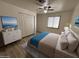 Cozy bedroom with a large closet, modern ceiling fan, and natural light from the window at 4734 N 61St Ave, Phoenix, AZ 85033