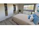 Well-lit bedroom featuring a large window, closet, and modern decor for a comfortable living space at 4734 N 61St Ave, Phoenix, AZ 85033