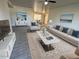 Bright living room with tile floors, a ceiling fan, and neutral colored furniture and decor at 4734 N 61St Ave, Phoenix, AZ 85033