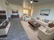 Bright living room with tile floors, a ceiling fan, and neutral colored furniture and decor at 4734 N 61St Ave, Phoenix, AZ 85033